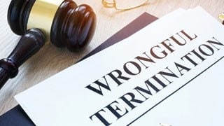 Wrongful termination document and gavel